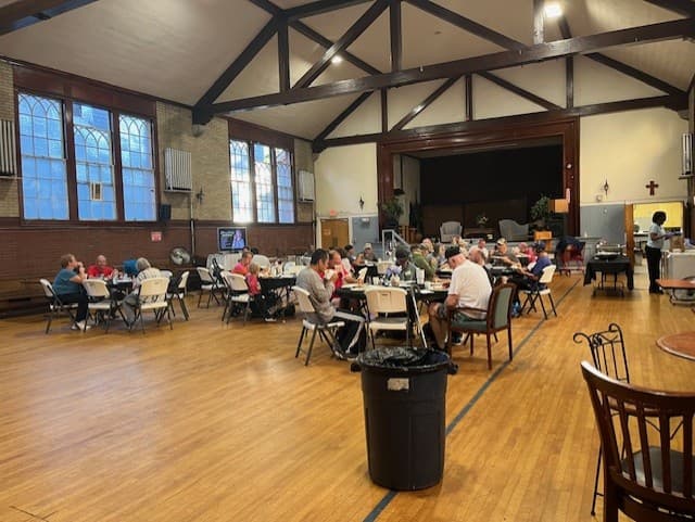 Dinner Church gathering in the hall
